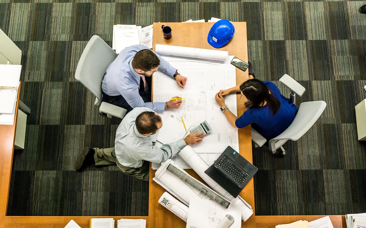 Meeting, business, architect — Paystub Generator Free vs. Excel Templates: Which Is Better?