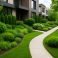 Lush landscape design featuring greenery and well-maintained shrubs along a pathway